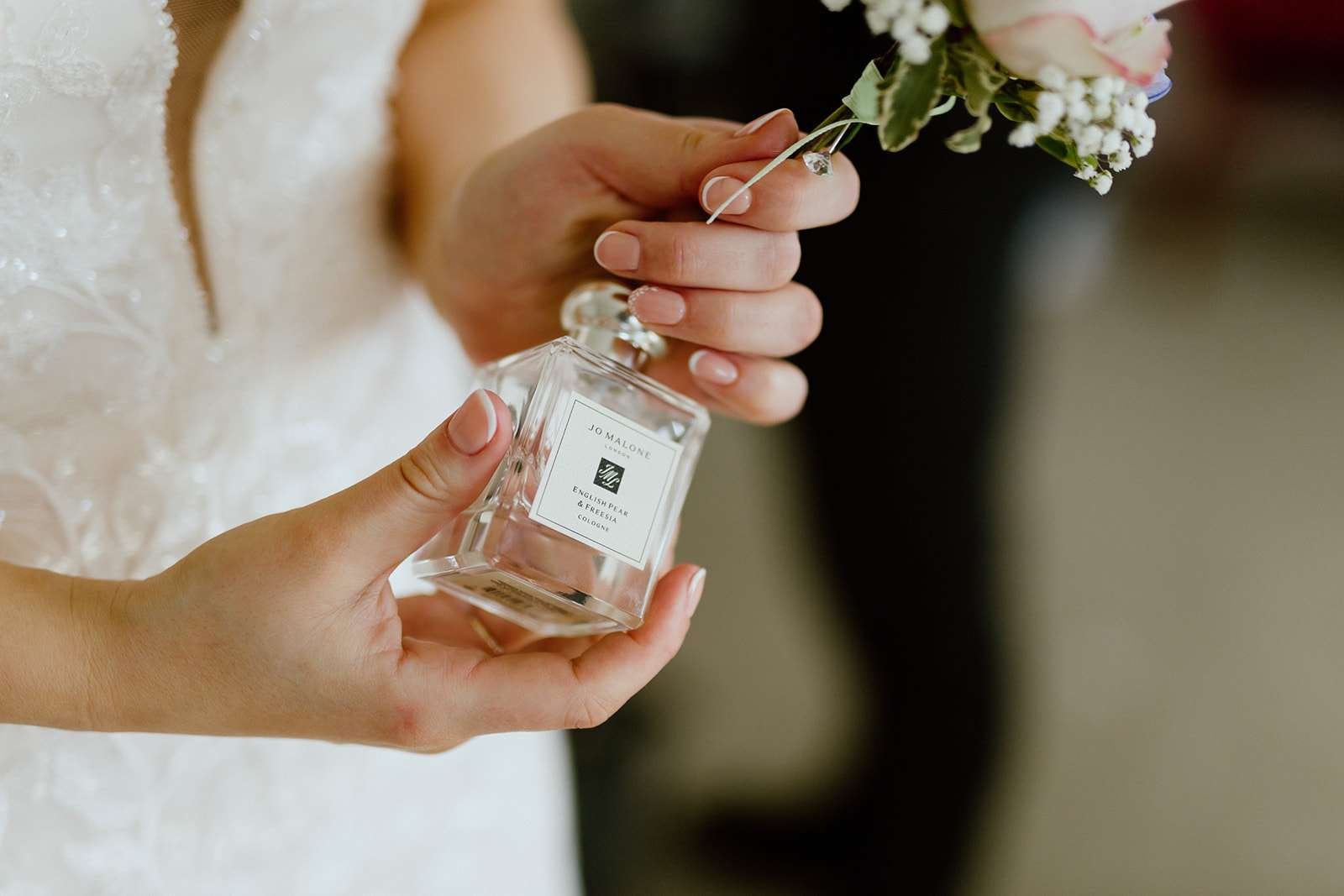 Candid moment of bride getting ready in the Verey Room