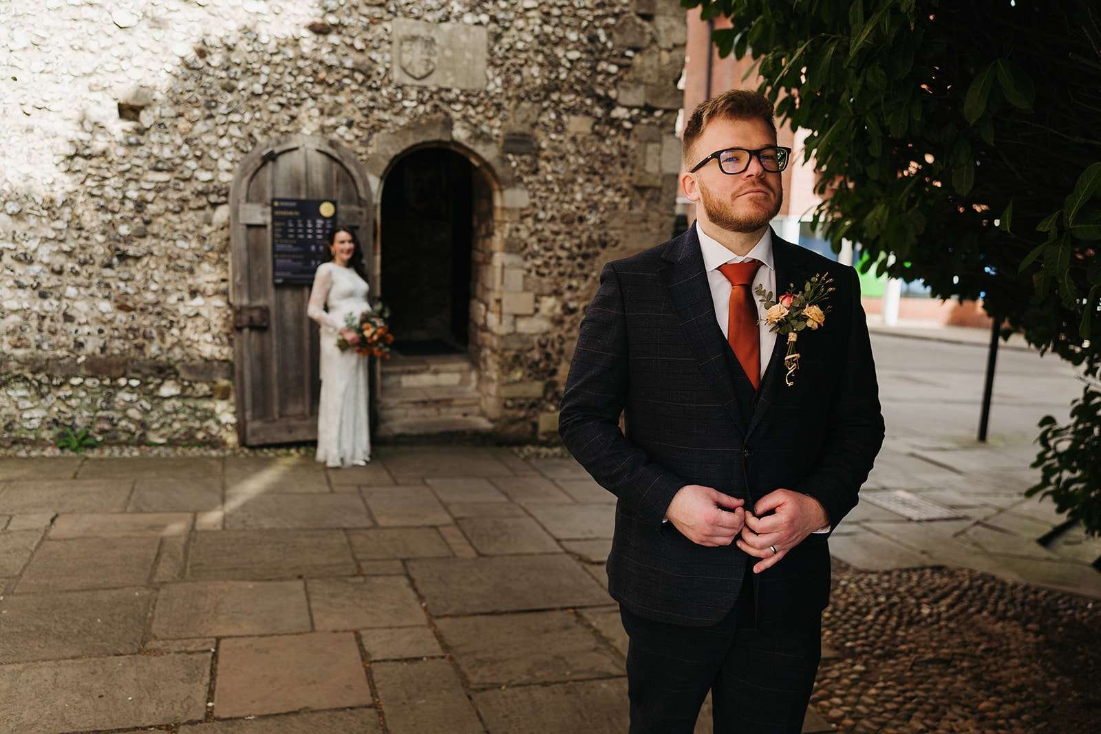 Bride and groom first look photoshoot outside Winchester Registry Office photo by Winchester wedding photographer