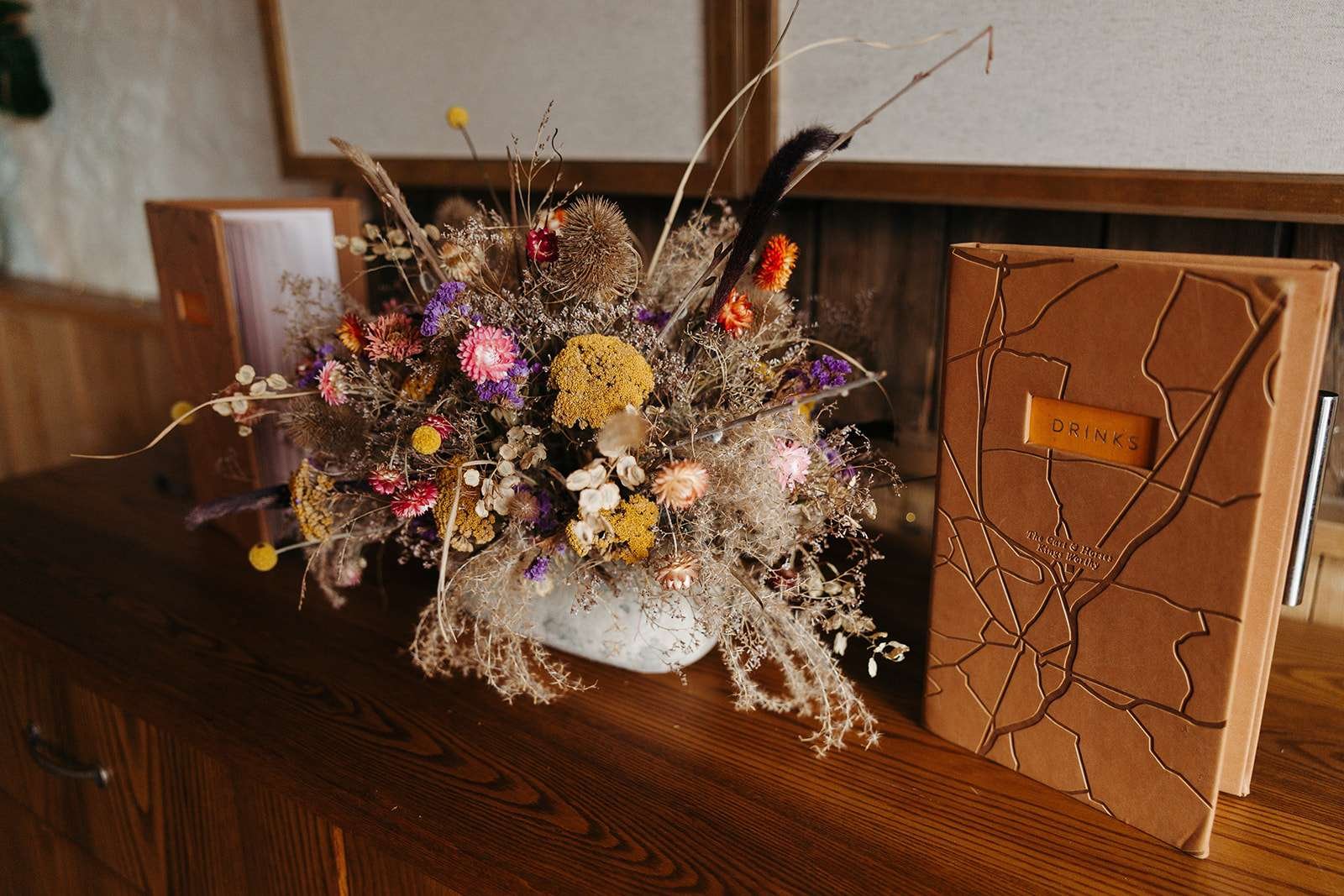 Rustic wedding reception setup inside The Cart & Horses, captured by a Winchester wedding photographer.