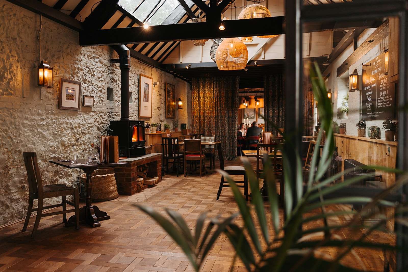 Rustic wedding reception setup inside The Cart & Horses, captured by a Winchester wedding photographer.