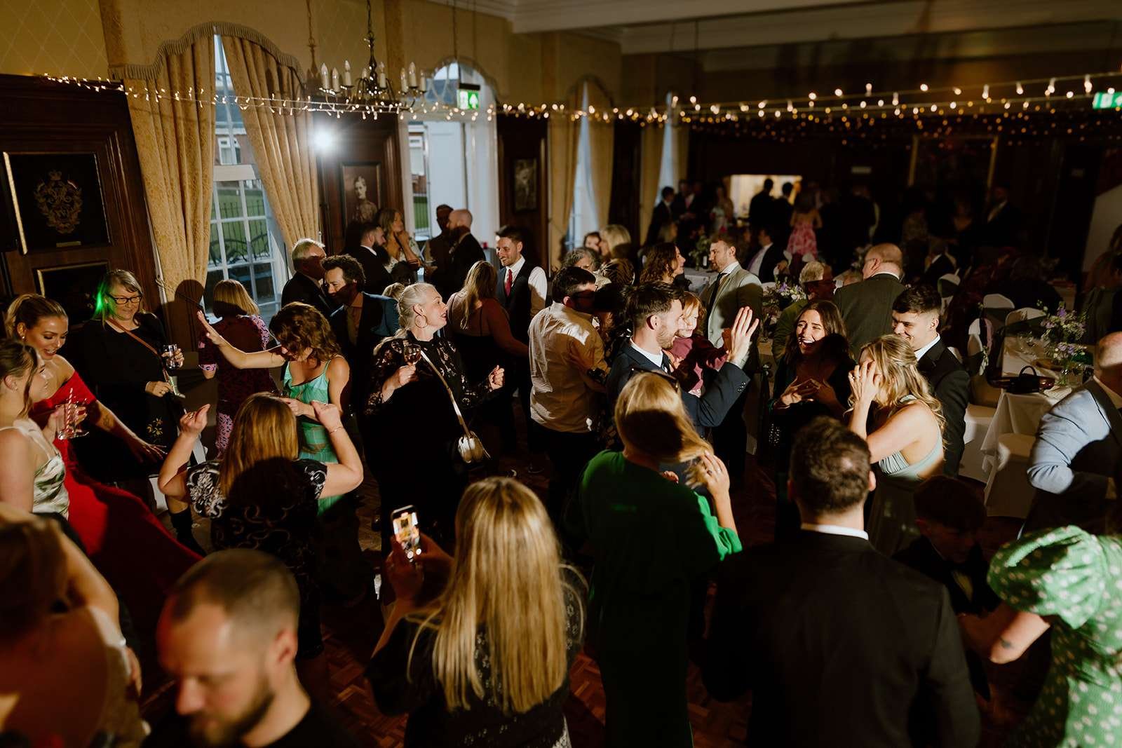 Wedding reception setup inside the oak-panelled Edmund Hall at antrobus house 