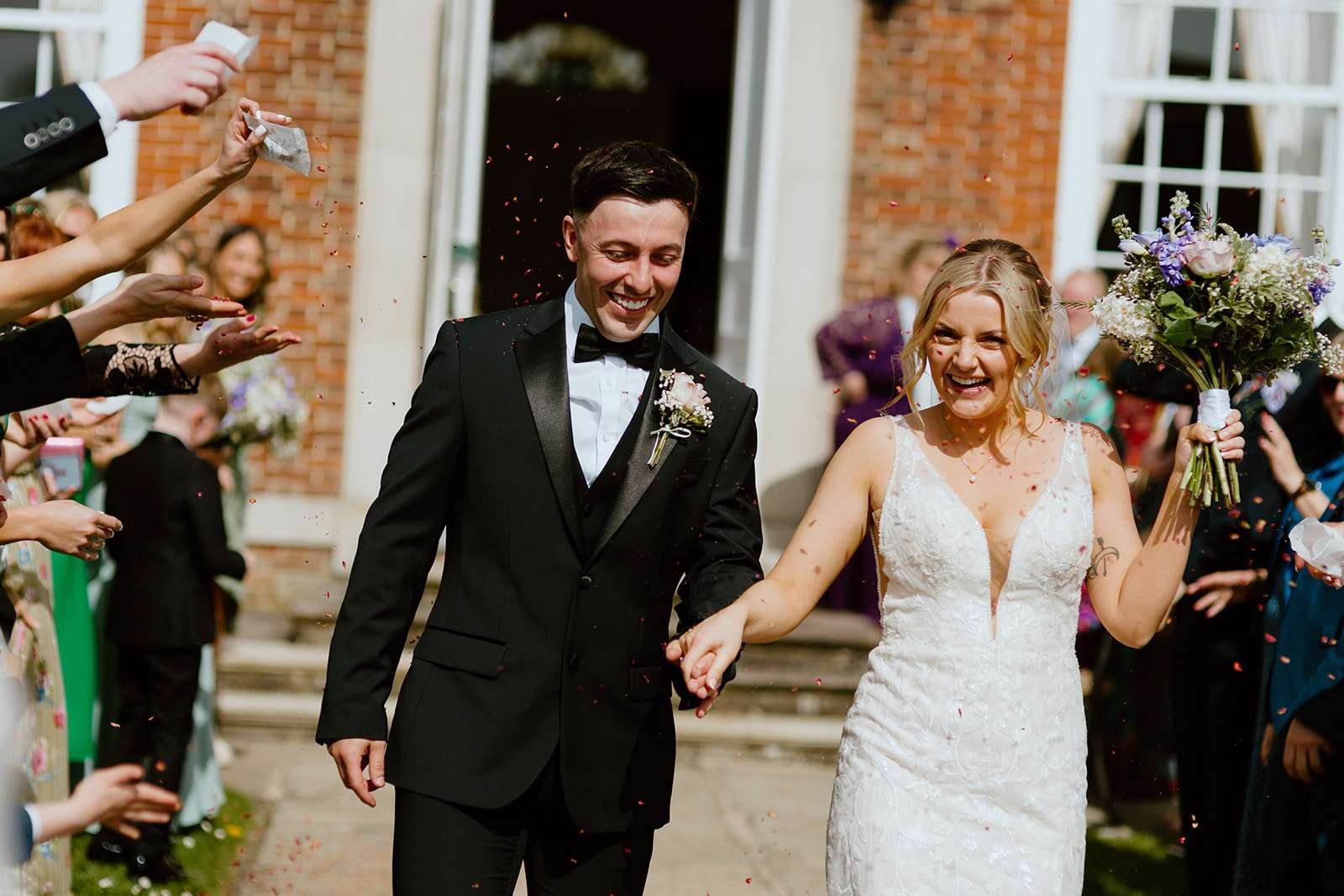 Classic confetti exit at the front steps of Antrobus House – cinematic wedding moment captured by a Wiltshire wedding photographer.