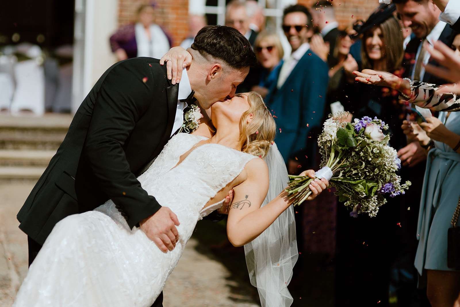 Classic confetti exit at the front steps of Antrobus House – cinematic wedding moment captured by a Wiltshire wedding photographer.