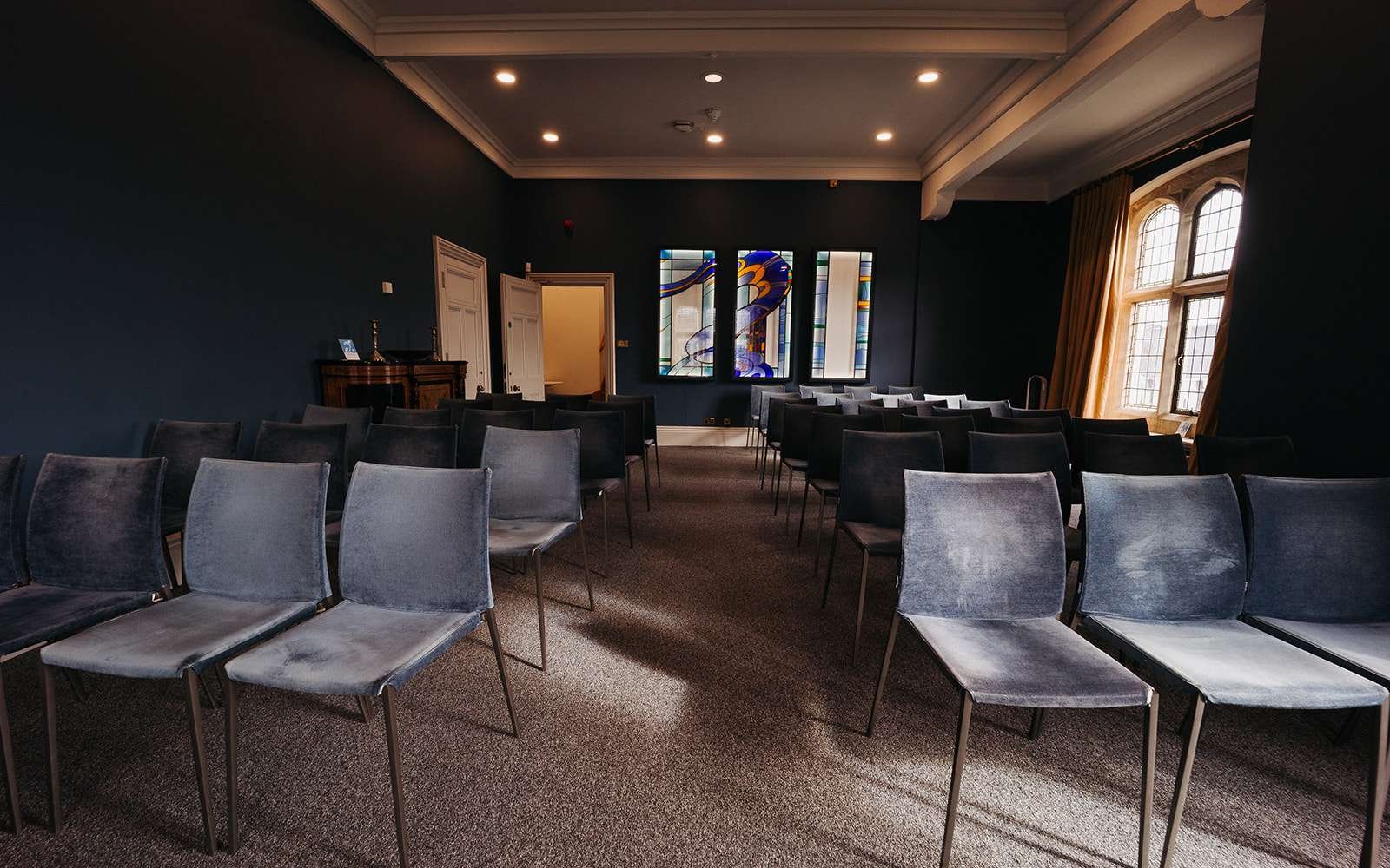The Castle Room at Winchester Registry Office set up for an intimate civil wedding ceremony.