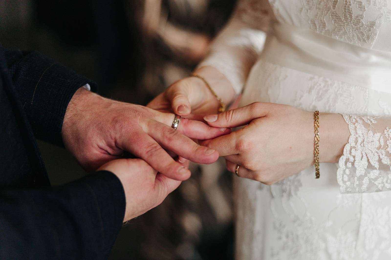 Detail shot of wedding rings and vows at a Winchester Registry Office ceremony.