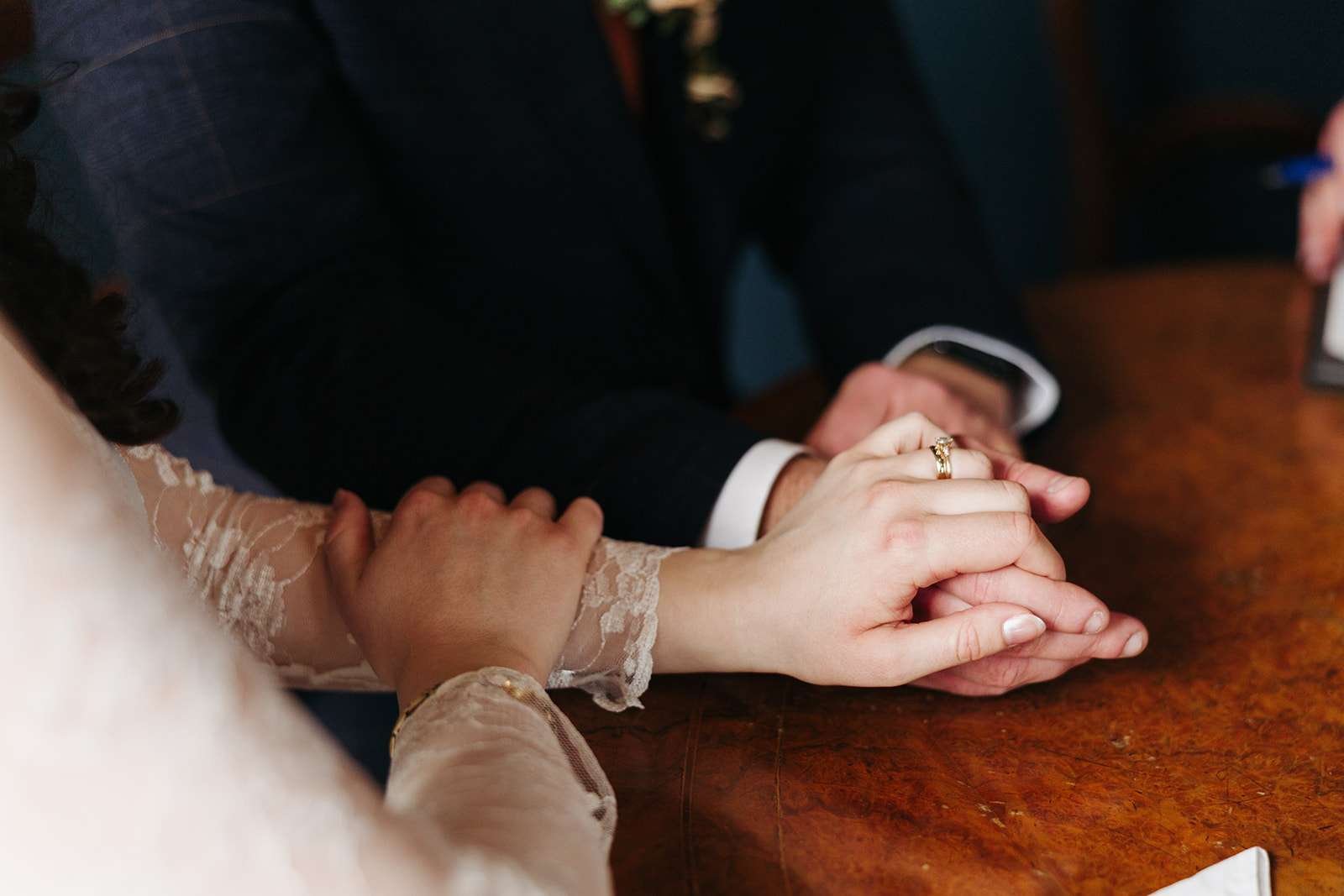 Detail shot of wedding rings and vows at a Winchester Registry Office ceremony
