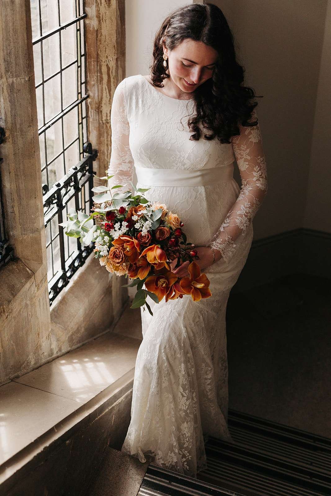 Bride and groom wedding photos: ceremonial staircase at Winchester registry office