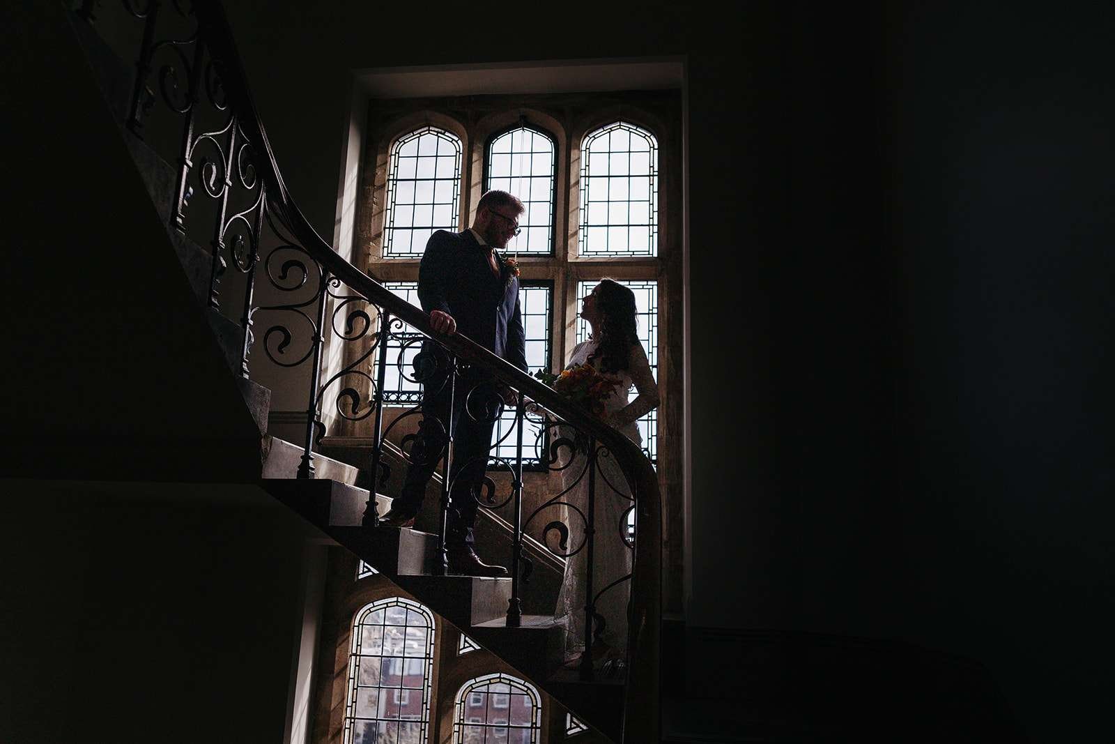Bride and groom wedding photos: ceremonial staircase at Winchester registry office