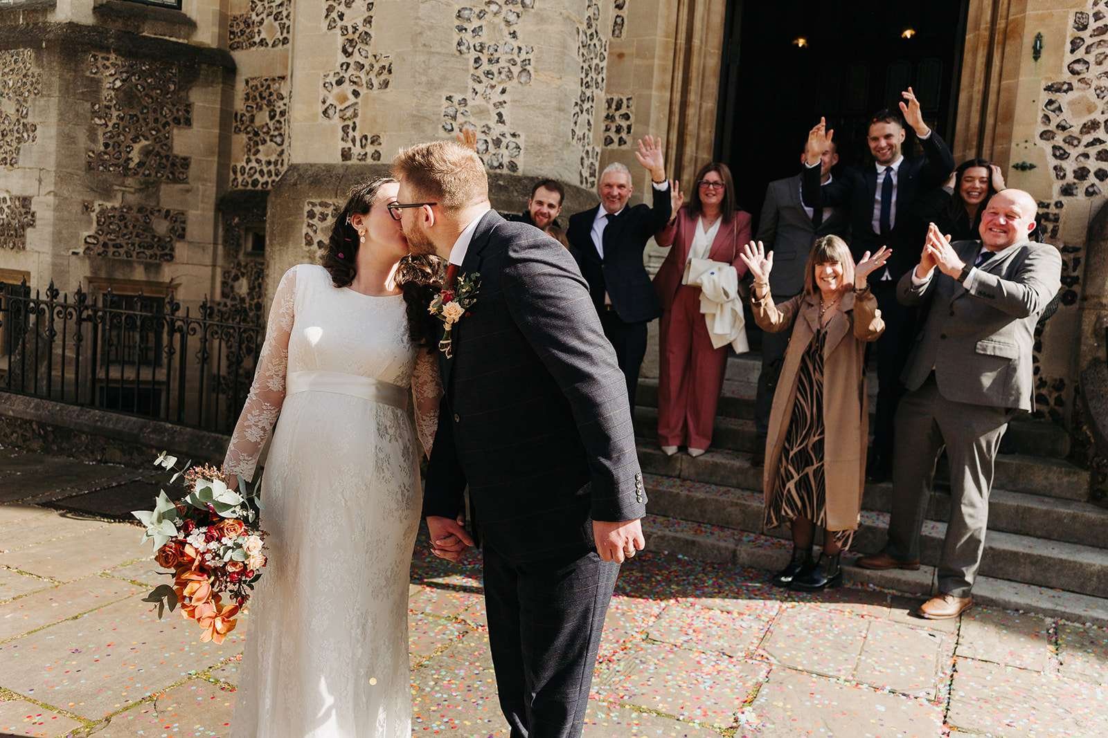 Just married couple sharing a quiet moment outside Winchester Registry Office photo by Winchester wedding photographer