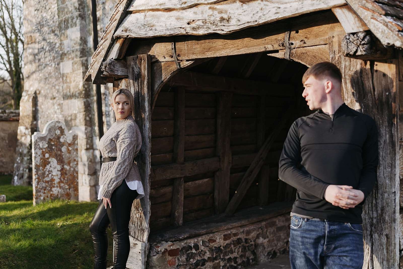 Intimate couple moment at golden hour, with Salisbury’s historic church in the background.