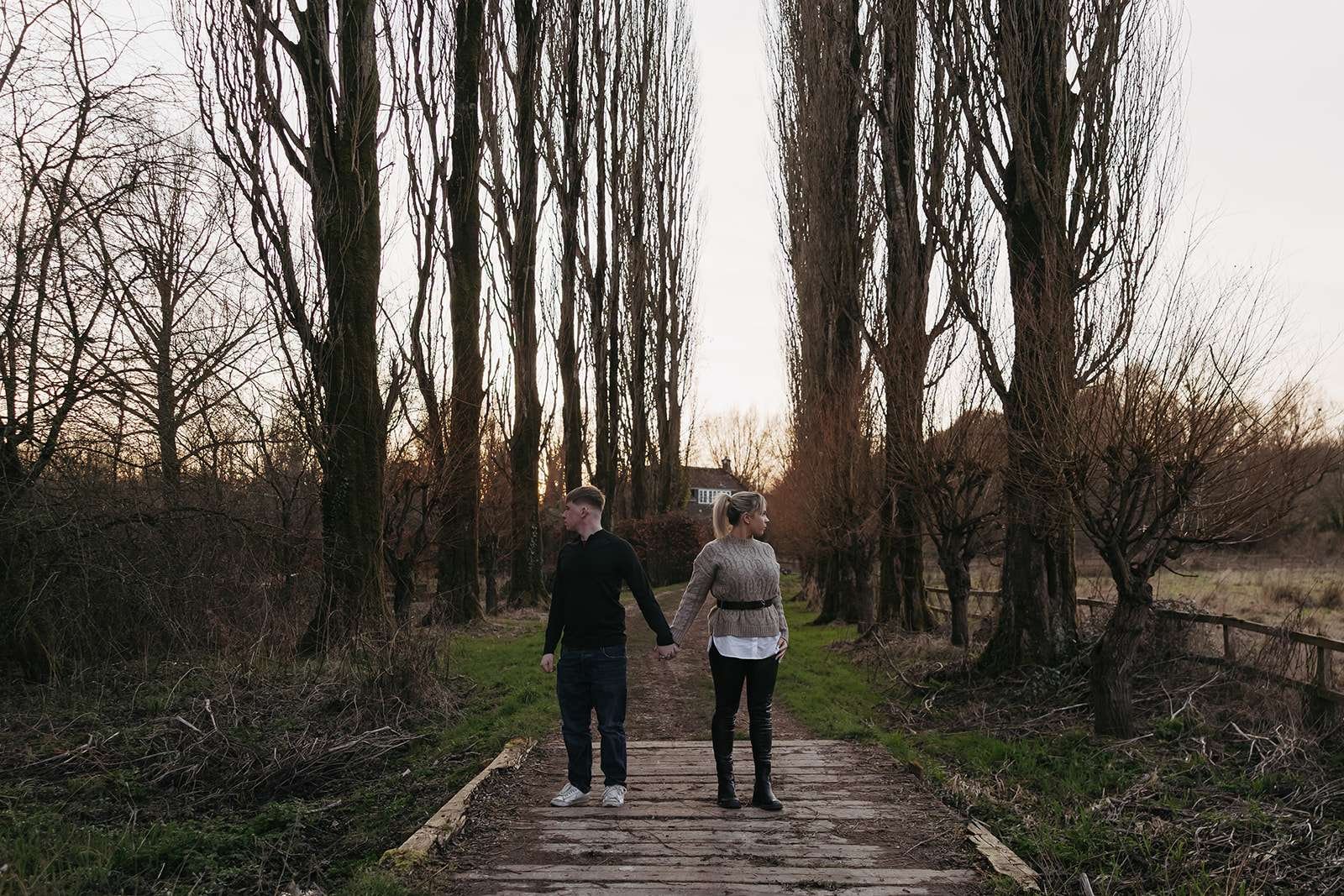 Engagement session on a picturesque footbridge in the English countryside.