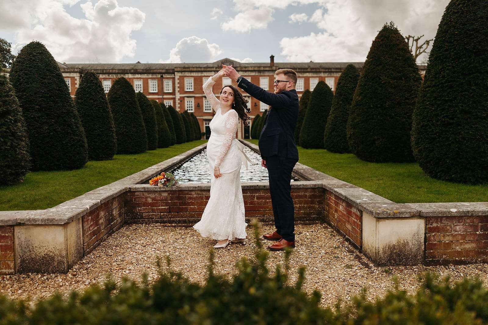 Bride and groom dance Peninsula Garden near Winchester Registry Office photo by Winchester wedding photographer