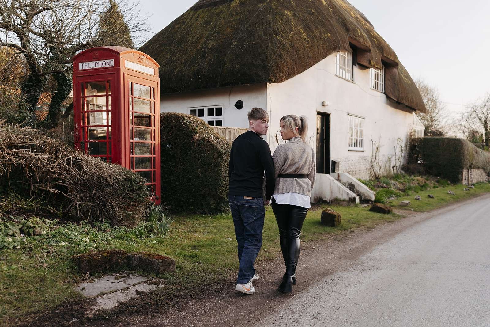 A romantic engagement session featuring a historic red telephone booth.