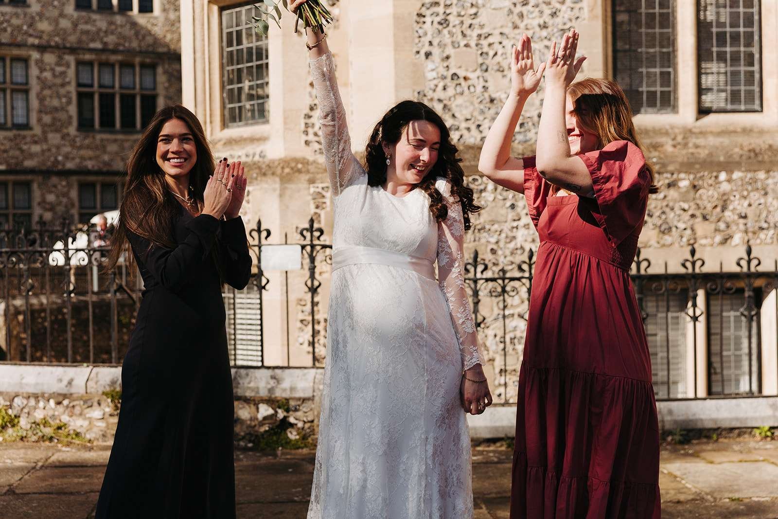 happy bride outside Winchester Registry Office photo by Winchester wedding photographer