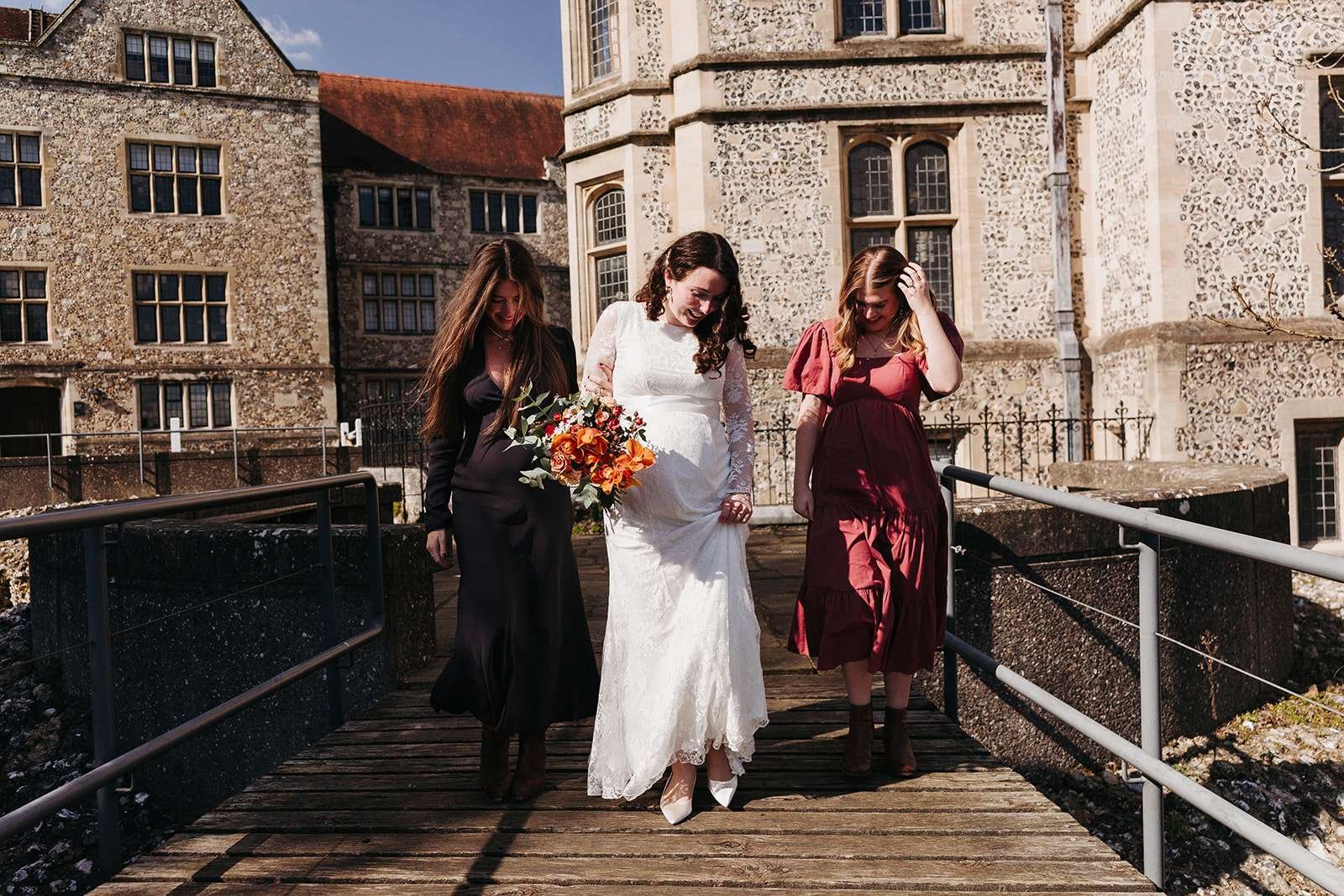 happy bride outside Winchester Registry Office photo by Winchester wedding photographer